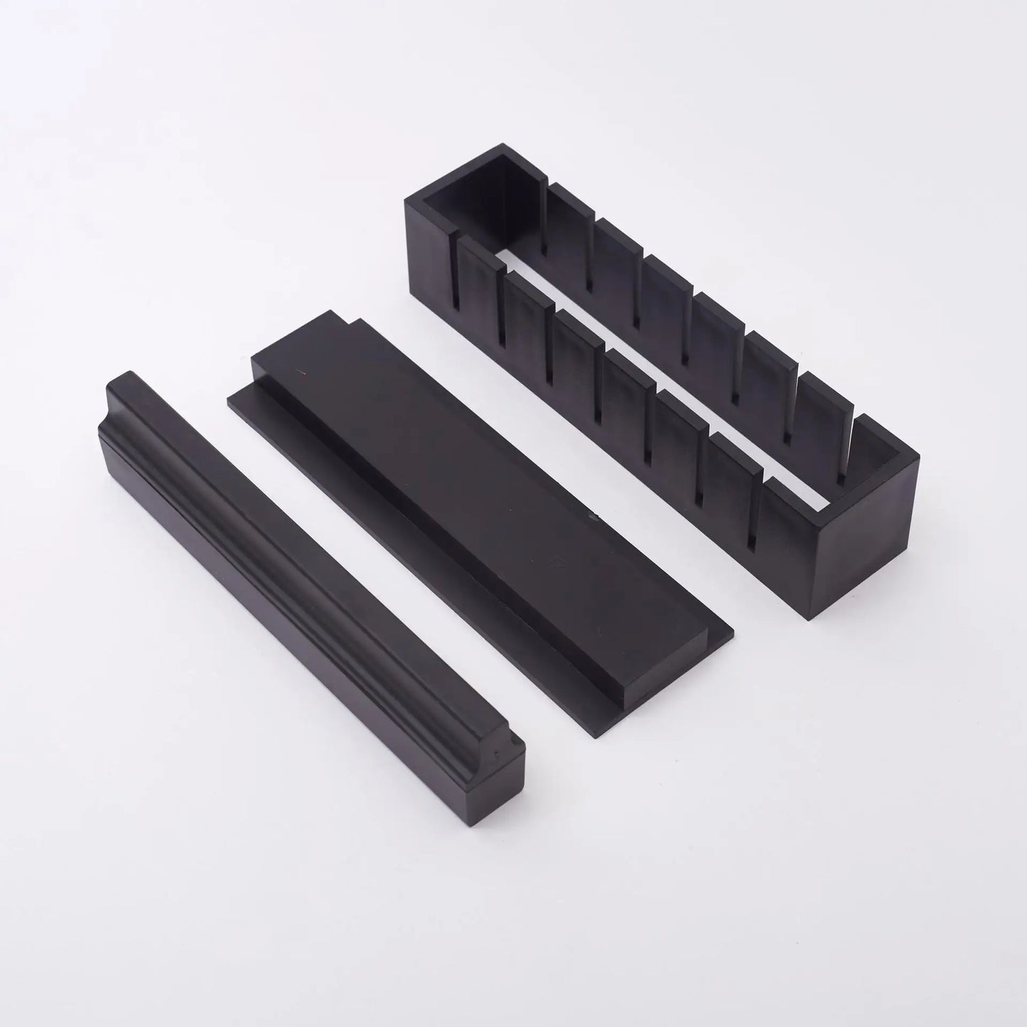 Sushi making kit with various sushi molds, fork, spatula, and utensils for making homemade sushi. Japanese sushi mold.