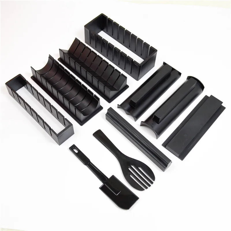 Sushi making kit with various sushi molds, fork, spatula, and utensils for making homemade sushi. Japanese sushi mold.