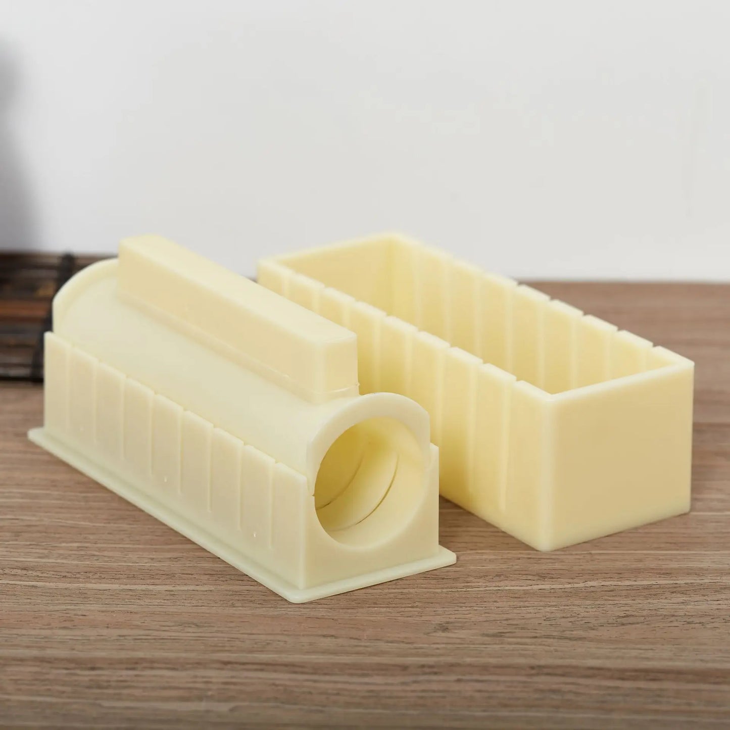 Sushi making kit with various sushi molds, fork, spatula, and utensils for making homemade sushi. Japanese sushi mold.