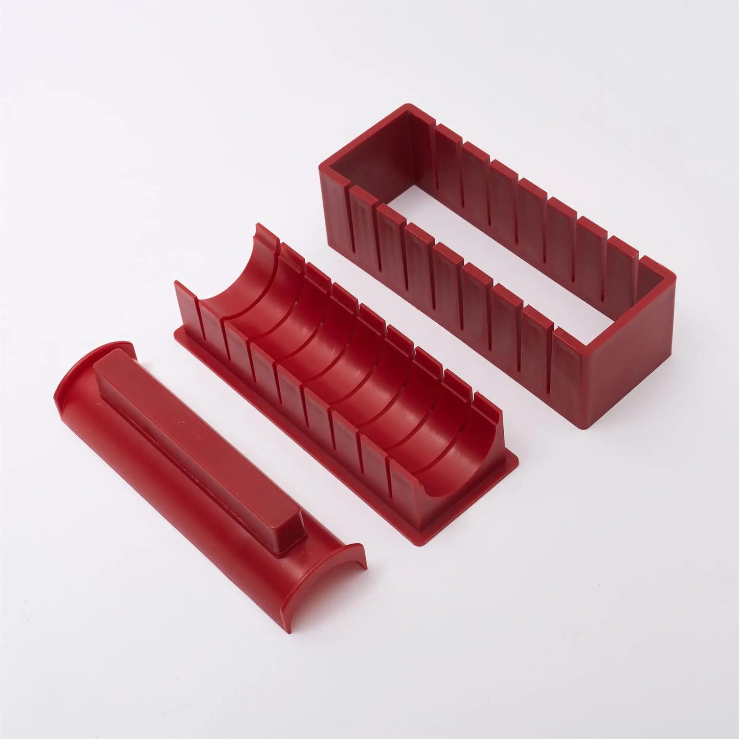 Sushi making kit with various sushi molds, fork, spatula, and utensils for making homemade sushi. Japanese sushi mold.