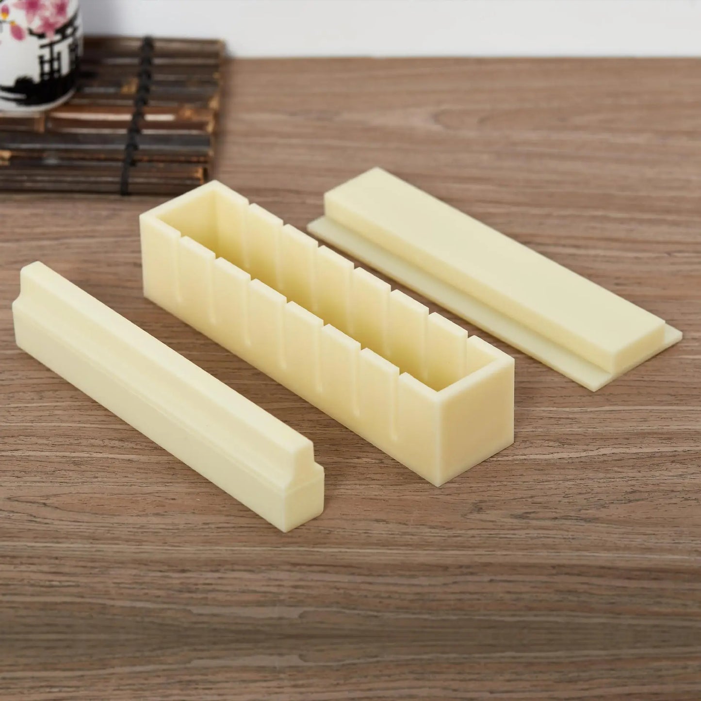 Sushi making kit with various sushi molds, fork, spatula, and utensils for making homemade sushi. Japanese sushi mold.