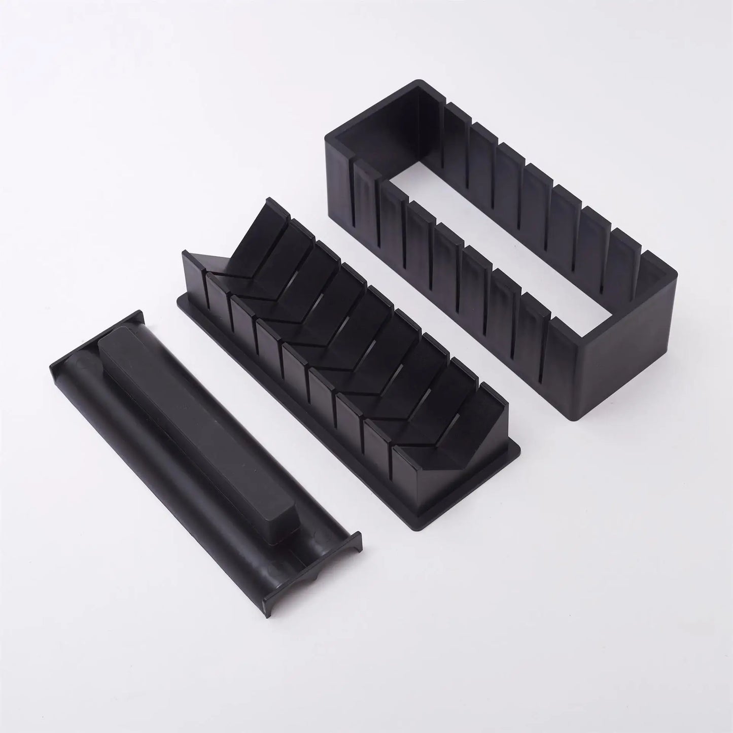 Sushi making kit with various sushi molds, fork, spatula, and utensils for making homemade sushi. Japanese sushi mold.