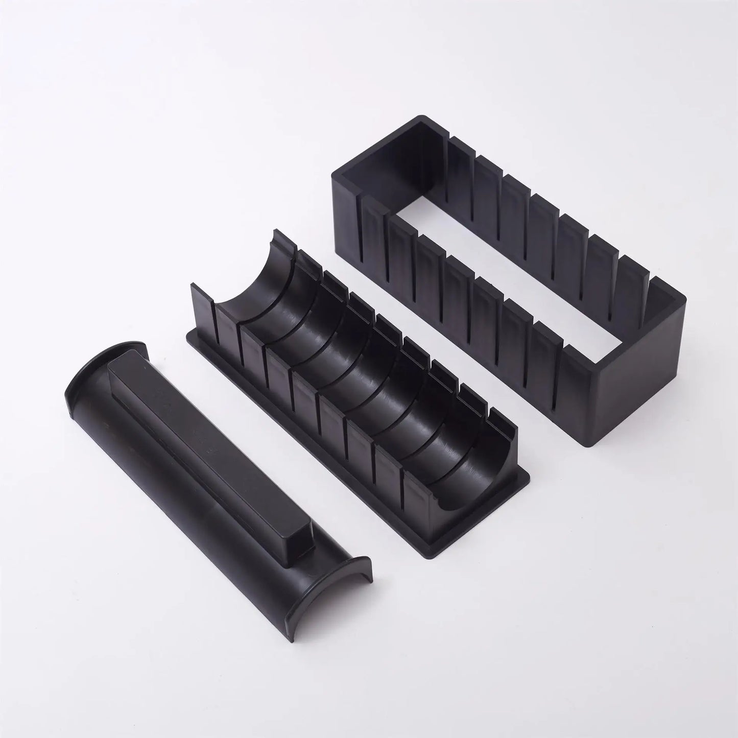 Sushi making kit with various sushi molds, fork, spatula, and utensils for making homemade sushi. Japanese sushi mold.